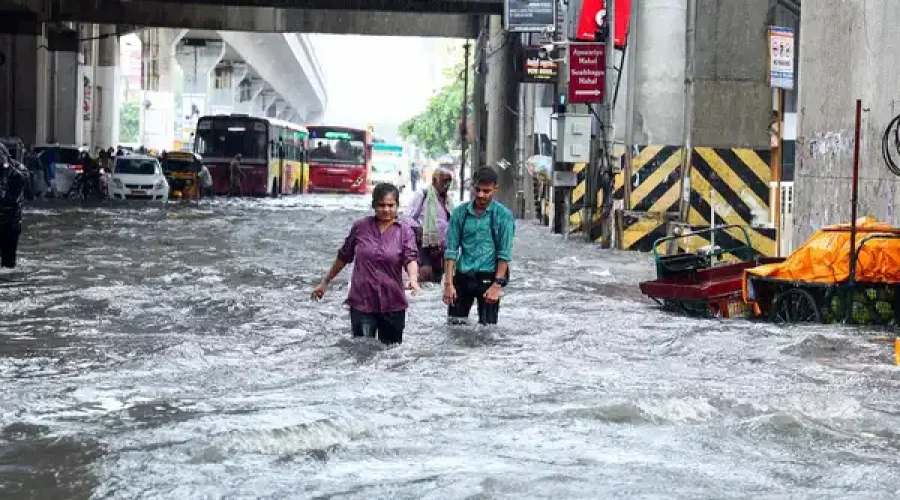 chennai-oct-15-ani-people-wade-through-flooded-street-amid-heavy-rainfall-i-